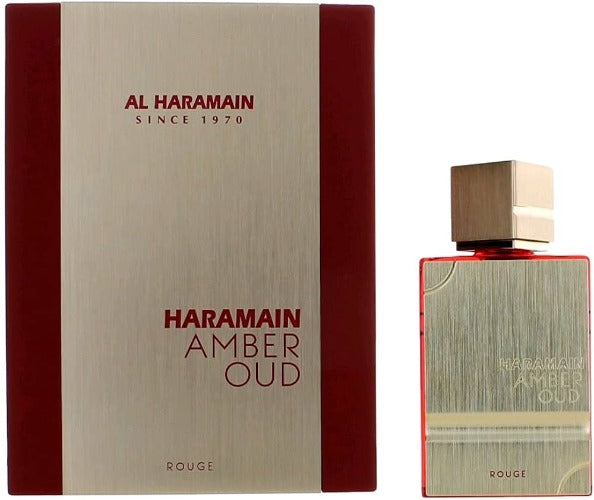 Al Haramain Amber Oud Rouge perfume bottle and box with wood grain texture and red accents