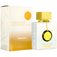 Armaf Club De Nuit Imperiale perfume bottle with gold cap and yellow pendant, displayed with cream and gold gradient box packaging