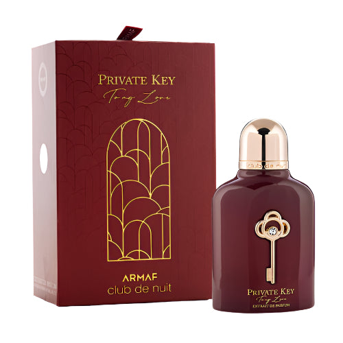 Armaf Club De Nuit Private Key burgundy fragrance bottle with gold key emblem next to maroon box with gold geometric design