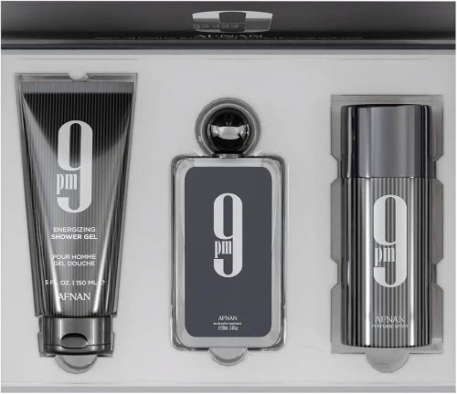 Afnan 9 Pm three-piece gift set with black shower gel tube, cologne bottle, and deodorant spray in gray packaging.