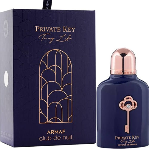 Armaf Club De Nuit Private Key navy bottle with rose gold cap next to dark blue box with gold geometric design
