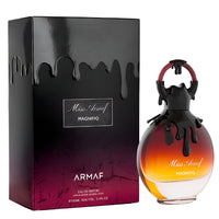 Armaf Miss Magnifiq perfume bottle with black drip design next to boxed packaging