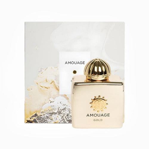 Amouage Gold Eau De Parfum bottle with gold dome cap next to packaging box with cream and gold design.