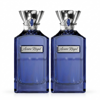 Two Azure Royal Extrait De Parfum bottles with silver stoppers side by side.