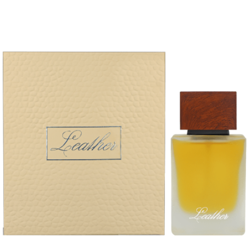 Leather fragrance bottle with golden liquid and brown wooden cap next to cream-colored box