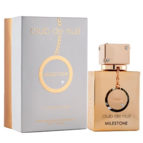 Armaf Club De Nuit Milestone perfume bottle with gold packaging and matching gray box with circular pendant charm