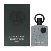 Afnan Supremacy Collector's Edition bottle with speckled gray container and black cap next to dark packaging box.