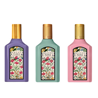 Gucci Flora Gorgeous mini fragrance set with three pastel bottles and floral label design front view