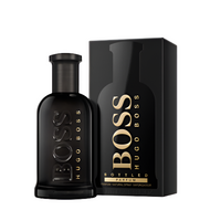 Boss Bottled Parfum black bottle with gold text next to matching black box packaging