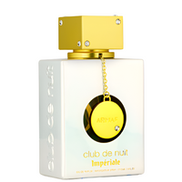 Armaf Club De Nuit Imperiale perfume bottle with white rectangular glass base, gold cap, and yellow circular charm pendant on chain.