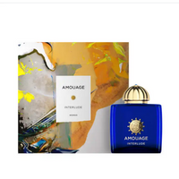 Amouage Interlude Woman fragrance bottle in cobalt blue with gold dome cap, displayed with abstract packaging.