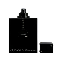 Black fragrance bottle with spray atomizer and small refill vial, labeled Club de Nuit Intense Man