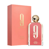 Afnan 9 Am Femme perfume bottle and matching coral-pink box with gold accents