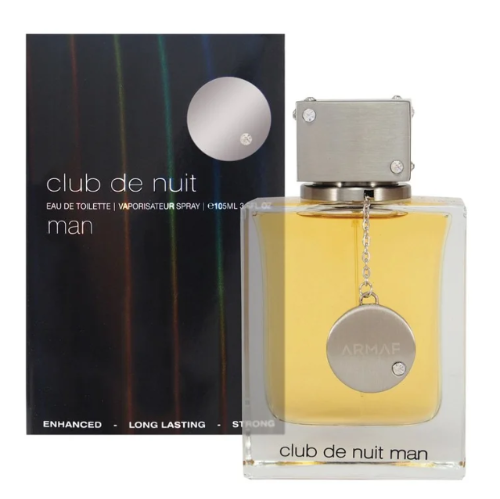 Armaf Club De Nuit man fragrance bottle with yellow liquid next to dark box packaging with silver medallion cap