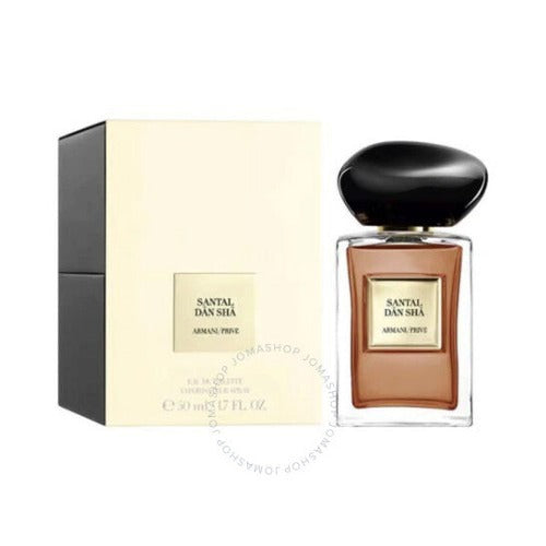 Armani Prive Santal Dan Sha fragrance bottle with black cap next to cream-colored box