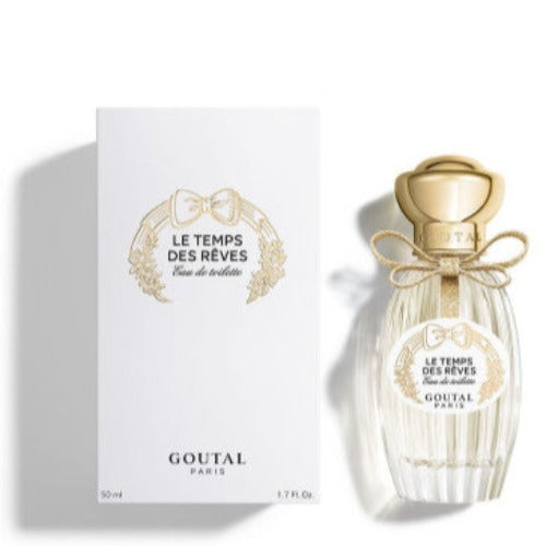 Annick Goutal Le Temps Des Reves fragrance bottle with gold cap and ribbon beside white box packaging