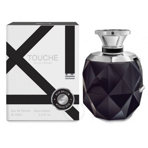 Afnan Rue Broca Touche fragrance bottle with geometric black pattern next to white and black striped box