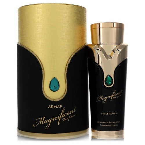 Armaf Magnificient perfume bottle with gold cylindrical box and black label featuring green teardrop gemstone detail