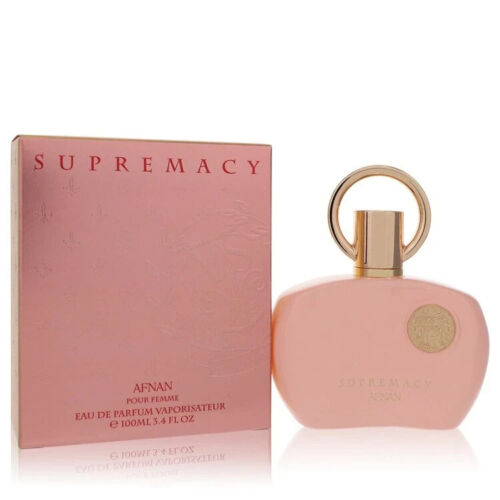 Afnan Supremacy Pink eau de parfum bottle next to pink box packaging
