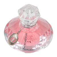 Pink Eau de Parfum bottle with crystal stopper and silver heart charm pendant