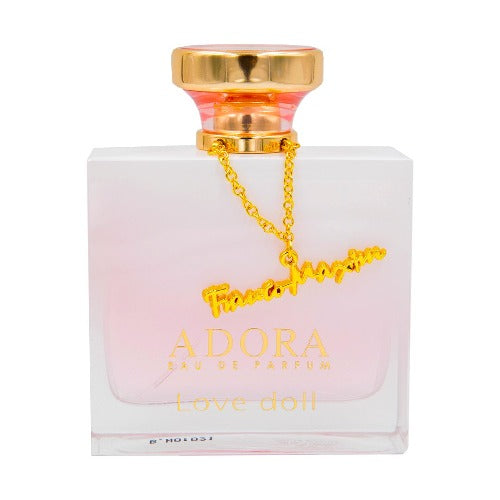 Adora Love Doll Eau De Parfum bottle with pink liquid, gold cap and chain charm against white background.