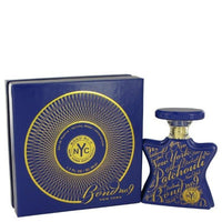 Bond No. 9 Patchouli fragrance bottle and blue box with gold circular design on white background