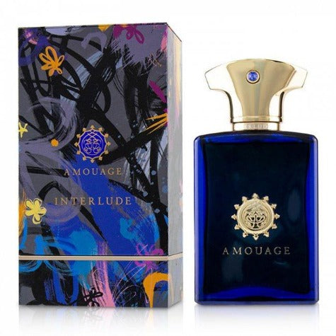 Amouage Interlude bottle and packaging. Deep blue glass bottle with gold cap next to colorful floral box.
