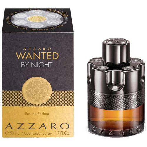 Azzaro Wanted By Night perfume bottle and box with gold accents on black background