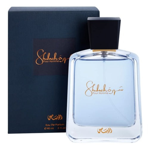 Rasasi Shuhrah Pour Homme Eau de Parfum 3.4 oz transparent bottle with dark blue packaging box front view