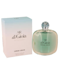 Air di Gioia perfume bottle with green liquid next to gradient pink and white box