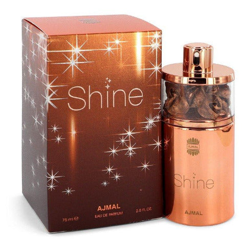 Ajmal Shine Eau De Parfum bottle and rose gold box with sparkle design