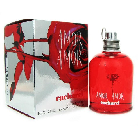Amor Amor red eau de toilette bottle with decorative box packaging featuring floral design