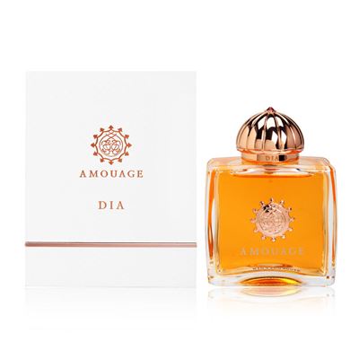 Amouage Dia fragrance bottle with golden liquid next to white branded box