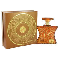 Bond No. 9 New York Amber perfume bottle with gold circular box packaging
