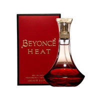 Beyonce Heat Eau De Parfum bottle with red liquid next to matching red and black box