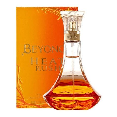 Beyonce Heat Rush fragrance bottle with amber liquid next to orange box packaging