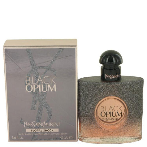 Black Opium Floral Shock fragrance bottle with gradient gray-to-bronze packaging beside its box