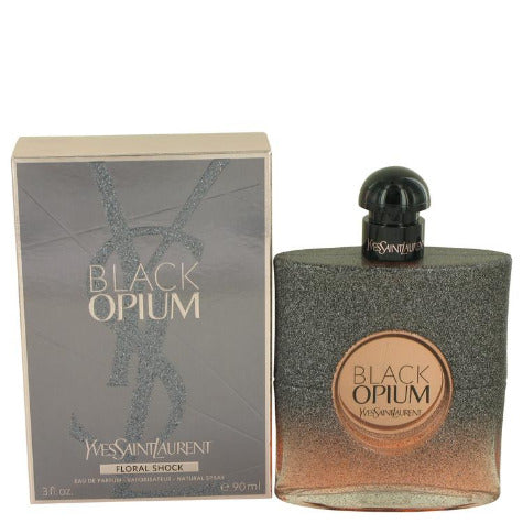 Black Opium Floral Shock perfume bottle and gray box with gold accents