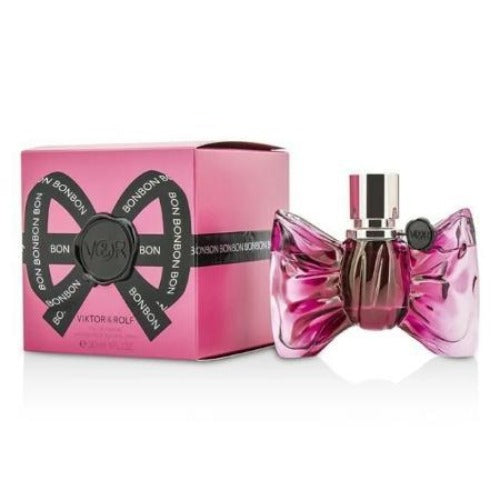 Bonbon pink eau de parfum bottle with bow-shaped design next to matching gift box