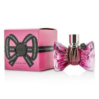Bonbon pink eau de parfum bottle with bow-shaped design next to matching gift box