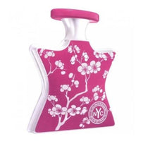 Bond No. 9 Chinatown pink parfum bottle with white floral branch design and pump dispenser
