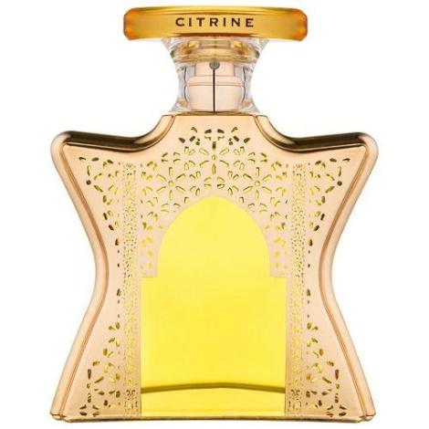 Bond No. 9 Dubai Citrine eau de parfum bottle with golden filigree design and yellow liquid center