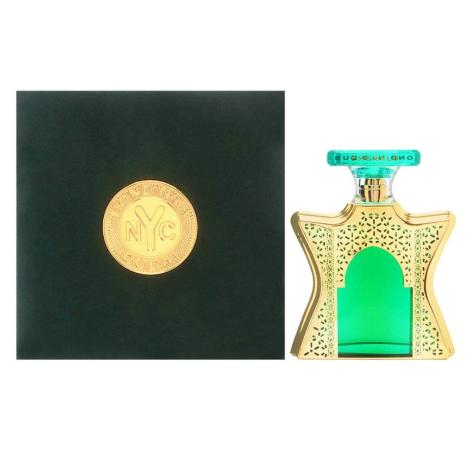 Bond No. 9 Dubai Emerald perfume bottle with green center and gold filigree design, displayed with dark gift box