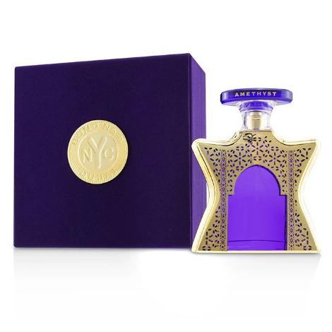 Bond No. 9 Dubai Amethyst perfume bottle with purple box and gold accents displayed together