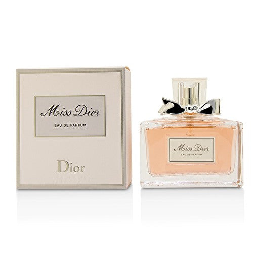 Miss Dior Eau de Parfum 3.4 oz clear glass bottle with soft pink liquid and silver bow with packaging box front view