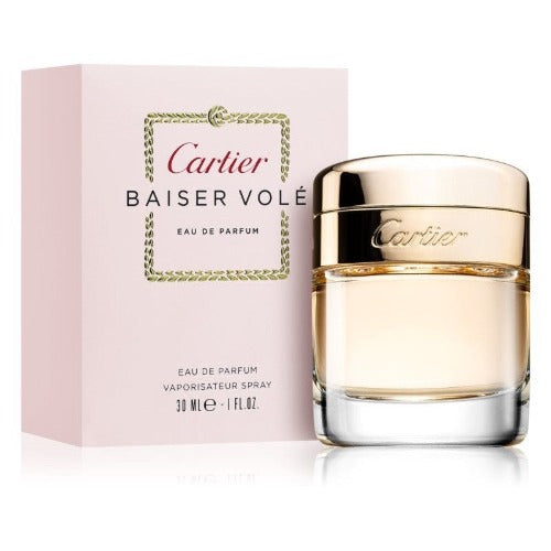 Cartier Baiser Volé Eau de Parfum bottle with pink box packaging displayed together.