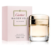 Cartier Baiser Volé Eau de Parfum bottle with pink box packaging displayed together.