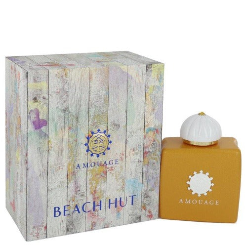 Amouage Beach Hut perfume bottle with white dome cap next to printed wooden box packaging