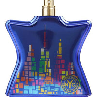 Bond No. 9 New York Nights bottle close-up showing pixelated skyline design with colorful buildings on blue glass.