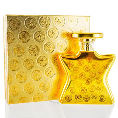 Gold square perfume bottle with matching decorative box featuring circular medallion pattern